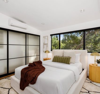 A modern Hollywood Hills home bedroom in Los Angeles, California, with a remodel of an older house